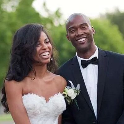 Both are posing in their wedding dress.